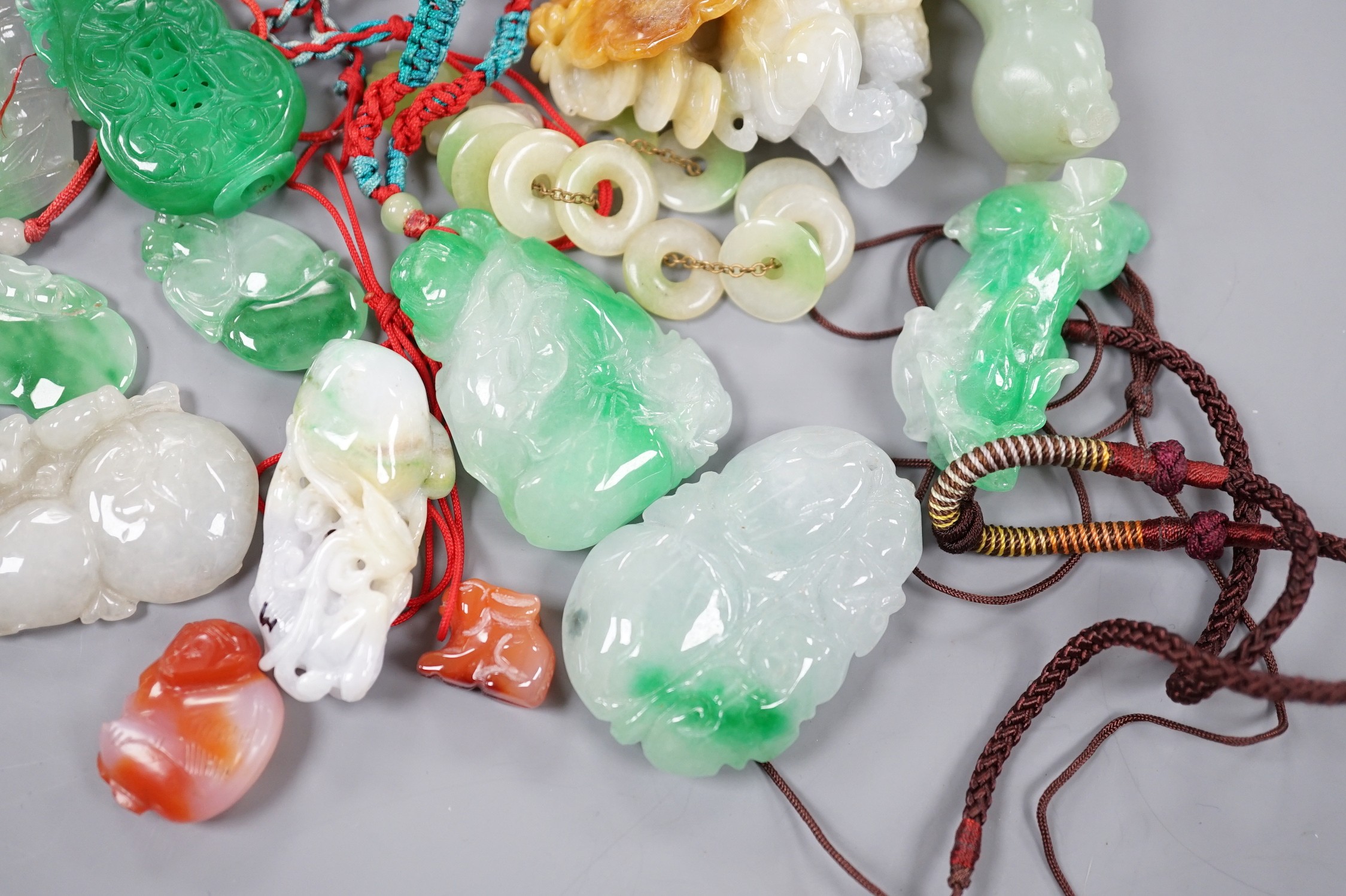 Seventeen pieces of jadeite and hardstone carved pendants and figures